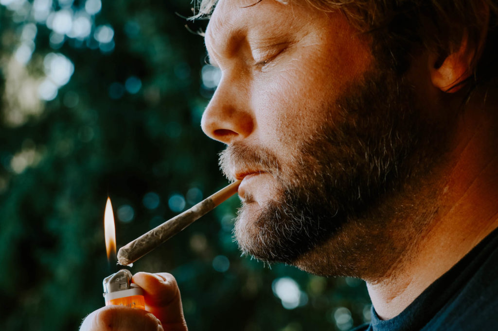 Man smoking a CBD joint
