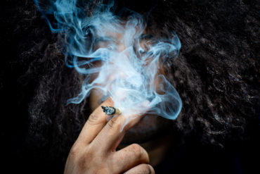 Man smoking a weed joint