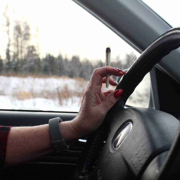 Smoking weed while driving a car