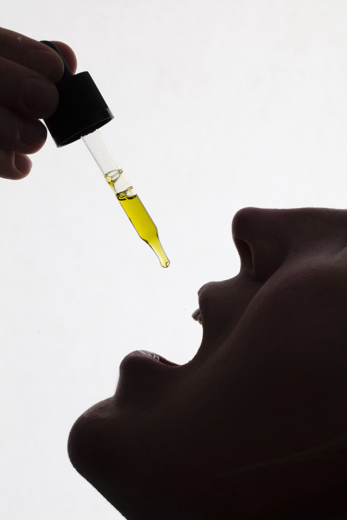Taking CBD oil under the tongue