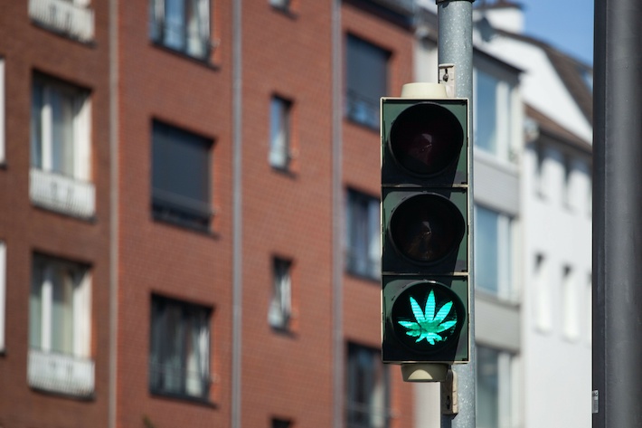 Traffic light with marijuana leaf sign