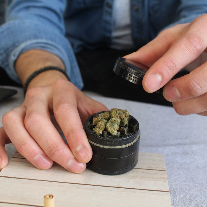 Grinding marijuana flower for making a joint
