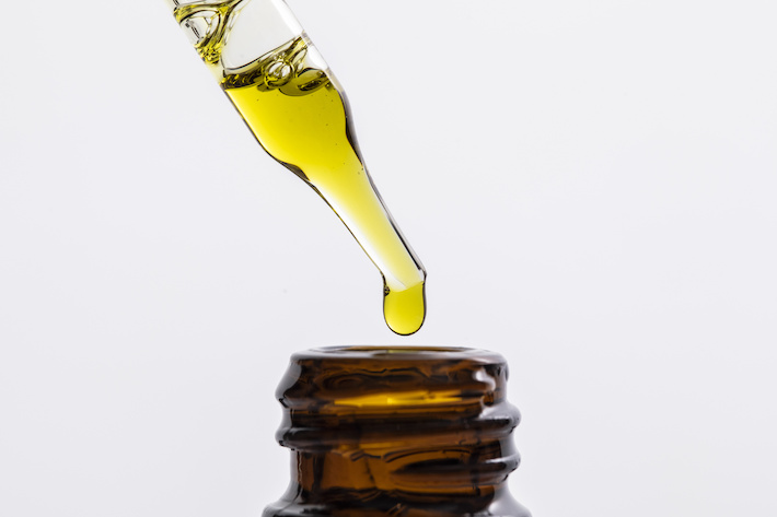 Close up of CBD oil in a dropper bottle