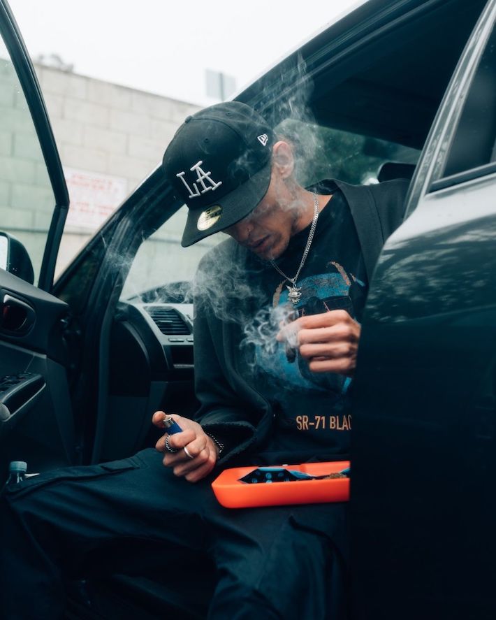 Man smoking cannabis in his car