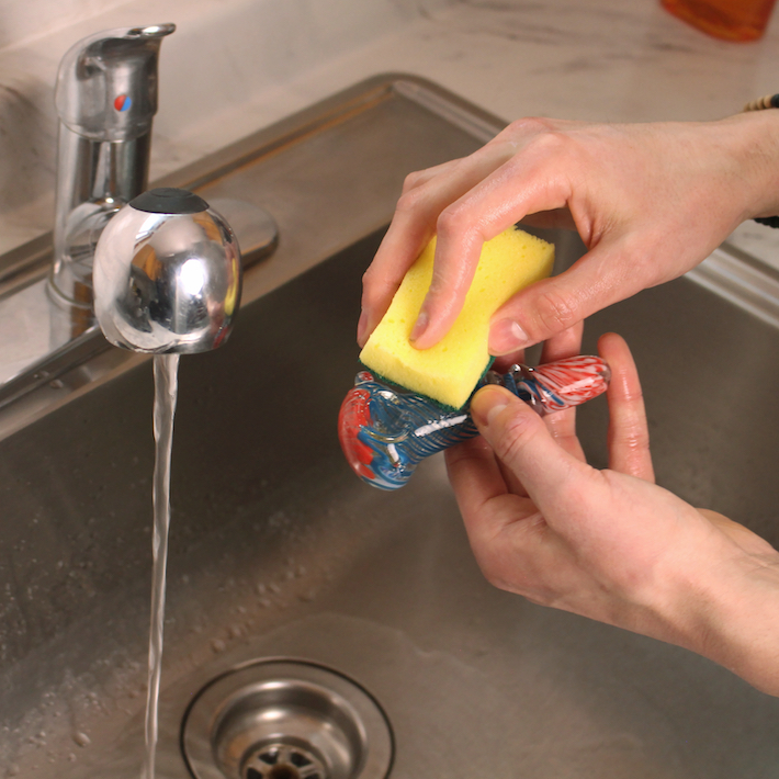 Washing pipe with dish soap and sponge