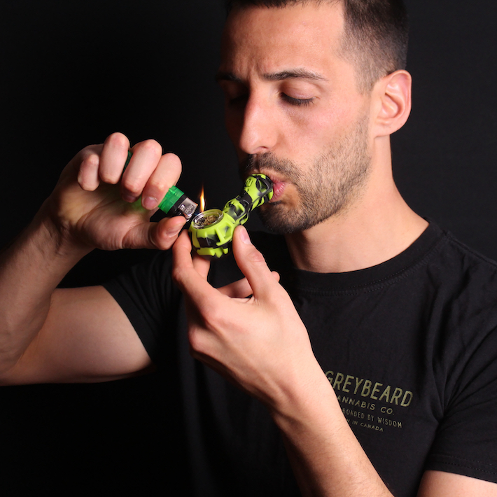 Smoking cannabis flower using the Eyce Spoon hand pipe
