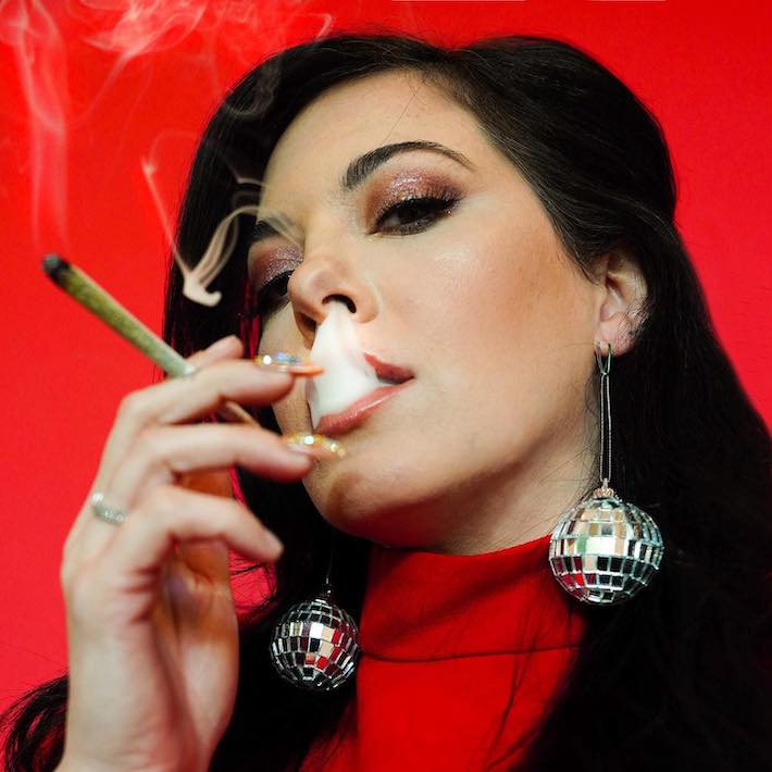 Olivia Alexander smoking Kush Queen cannabis product