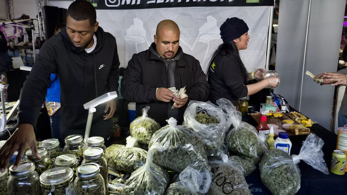 People selling illicit marijuana at a black market store 