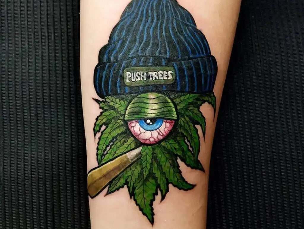 Cannabis leaf tattoo design on human arm