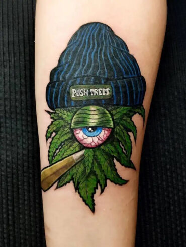 Cannabis leaf tattoo design on human arm
