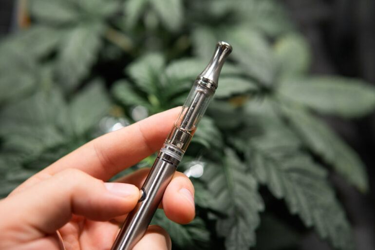 Consumer vaping a delta-10 THC vape pen