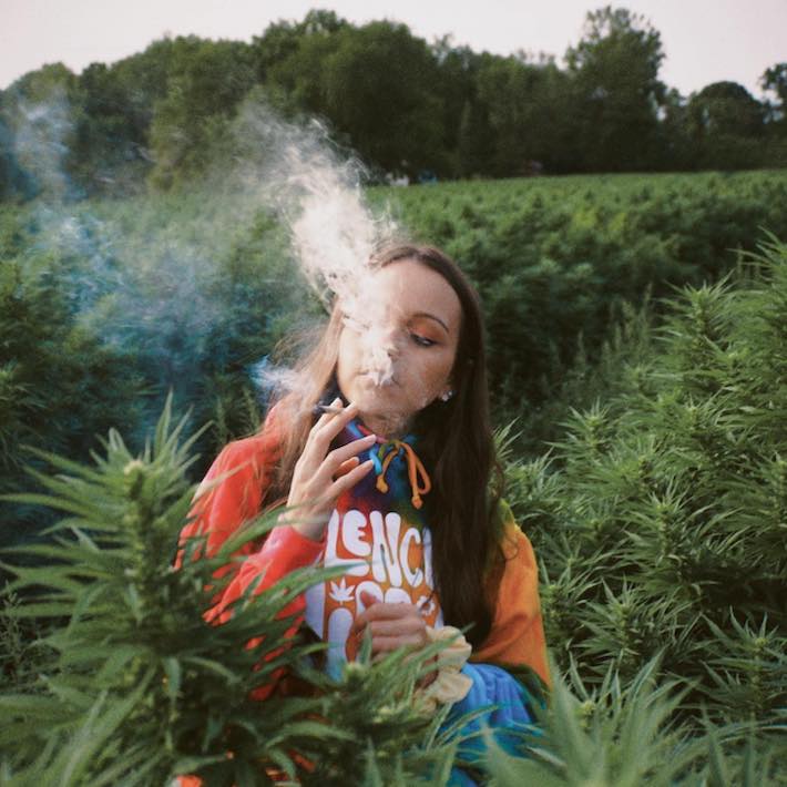 Sasha Lee smoking weed in a cannabis farm