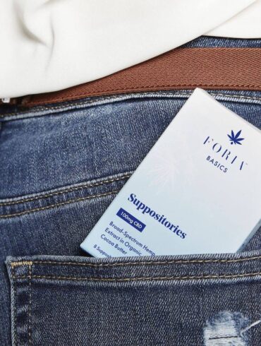 Woman holding CBD suppositories in her pocket