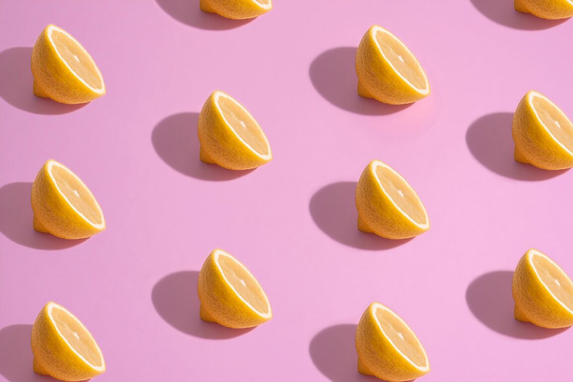 Lemon fruit on a pink background